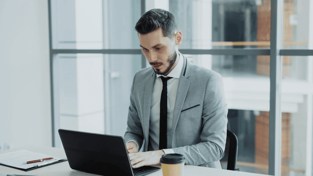 professional man working on laptop in office
