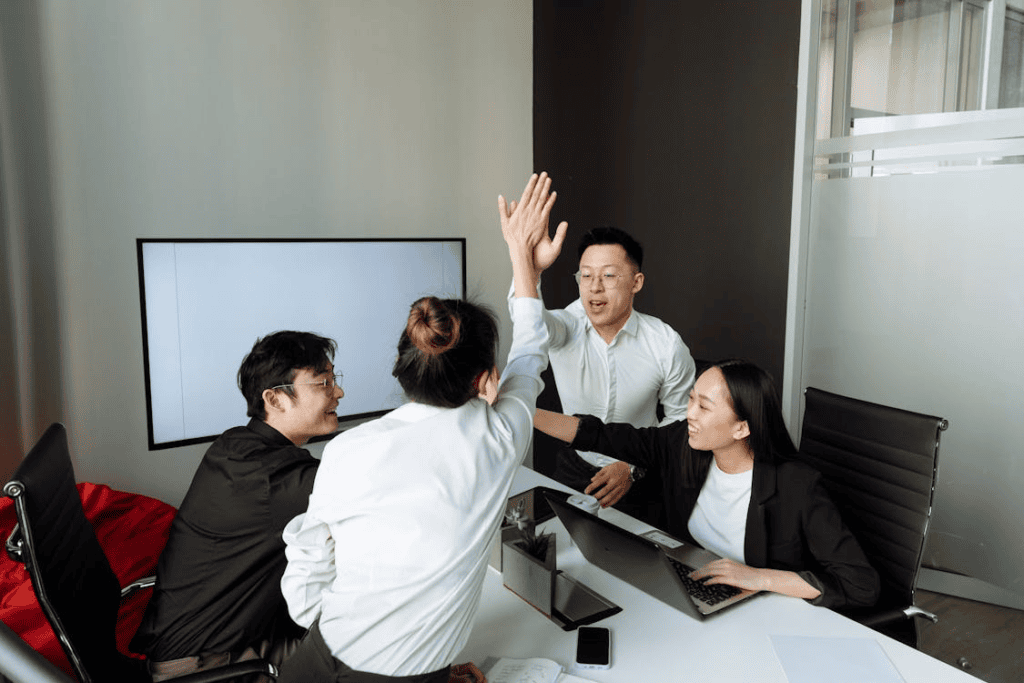 a group of people having a meeting in the office