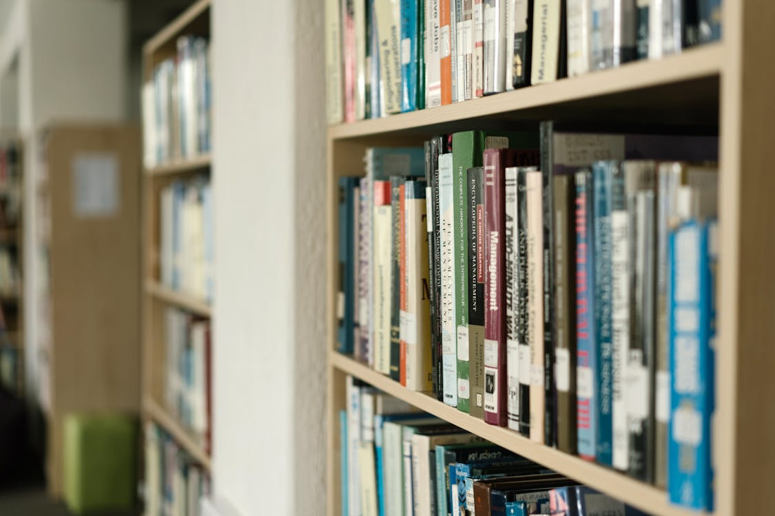 Close-Up Shot of Books on a Bookshelf