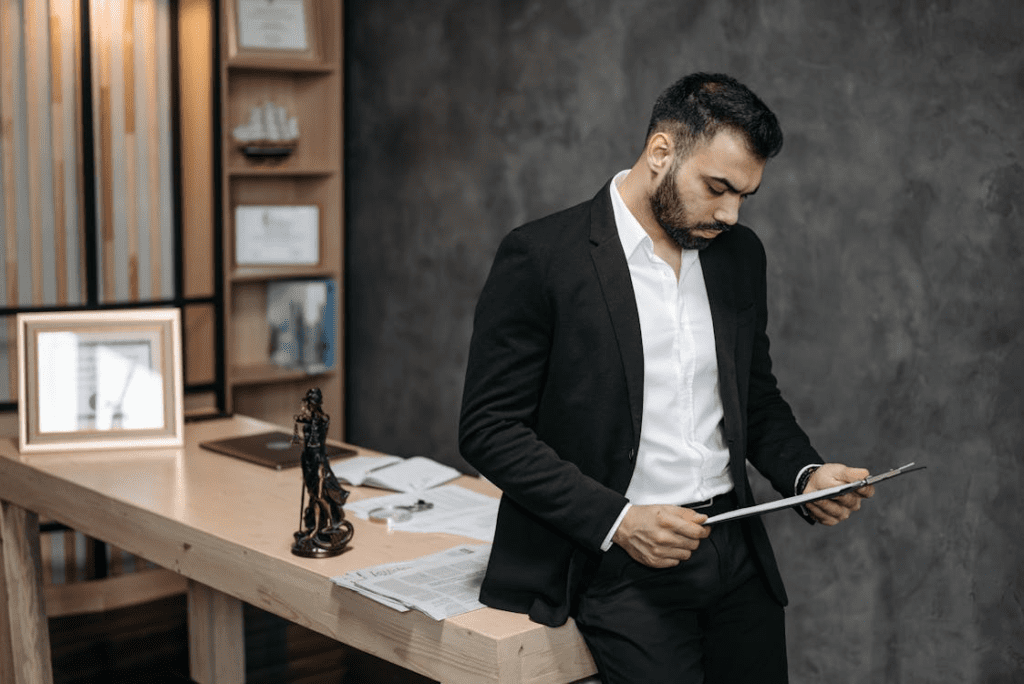 A senior attorney reviewing documents at a desk, representing career decisions in the legal industry